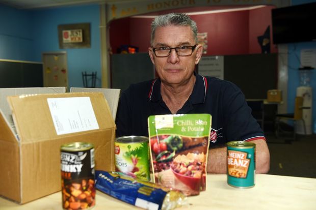 Major Bruce Ellicott with some of the food parcels they hand out. Photo Vicki Wood / Caboolture News
