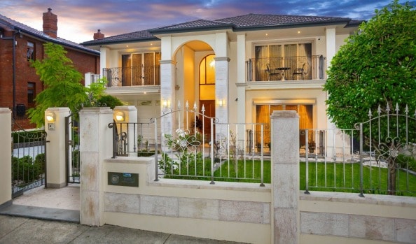 Record home auctions in Melbourne and Brisbane but clearance rates hold strong