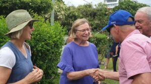 Author and community champion Judy Magub congratulates the new owners of her ancestral home in New Farm. Picture: Debra Bela